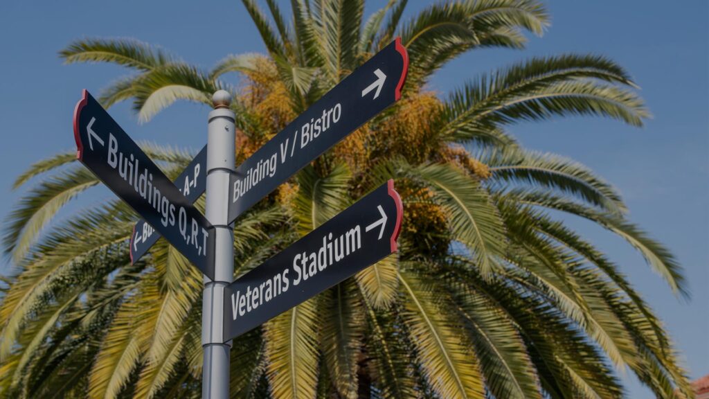 Long Beach City College signage with directions to Building V/Bistro, Buildings Q,R,T and Veterans Stadium