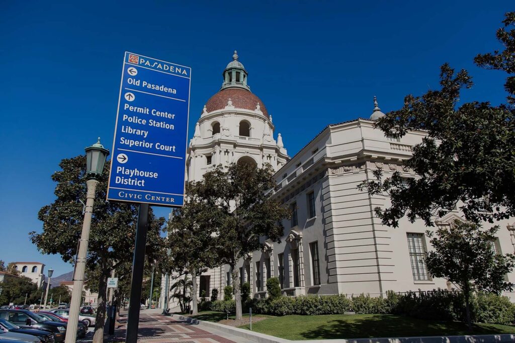 Signage with Pasadena City Hall in the background